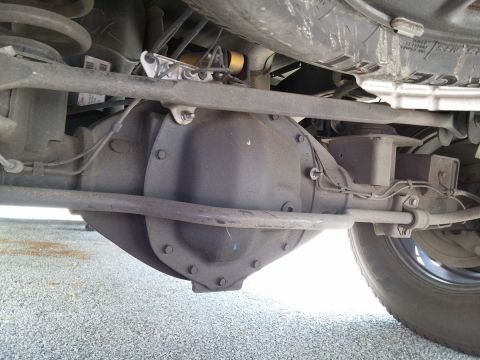 2000 Ford Crown Victoria - Underside view of a vehicle's rear axle differential and suspension parts.