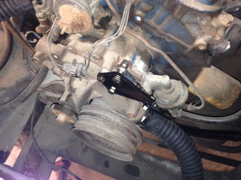 1979 Ford Bronco - Underside view of a vehicle's engine compartment, focusing on the steering linkage and associated components.