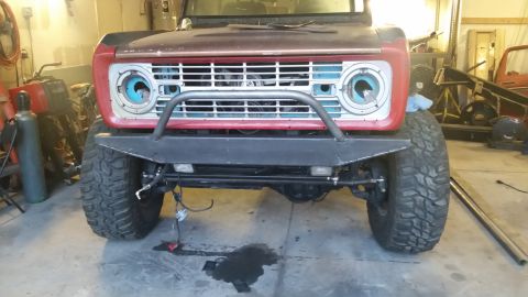 1979 Ford Bronco - This modified Ford Bronco, likely from the late 1970s, is shown with a custom front bumper and off-road tires.