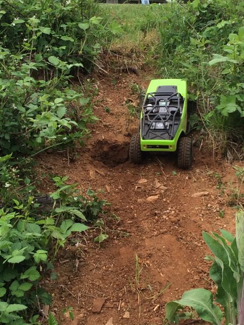 1989 Ford Bronco - This remote-controlled rock crawler navigates a rough, outdoor terrain.