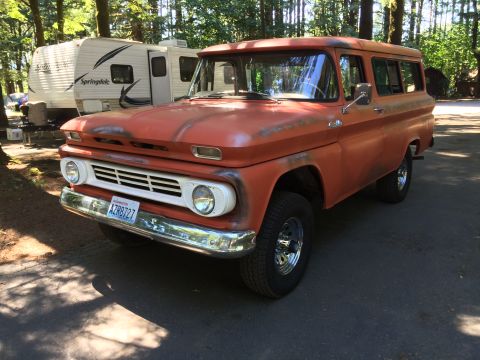 1962 Chevrolet Suburban - This vintage Chevrolet Suburban displays a distinctive grille and body style consistent with the early 1960s.