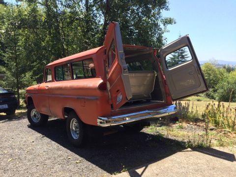 1962 Chevrolet Suburban - This Chevrolet Suburban has its rear doors open, revealing the cargo area.