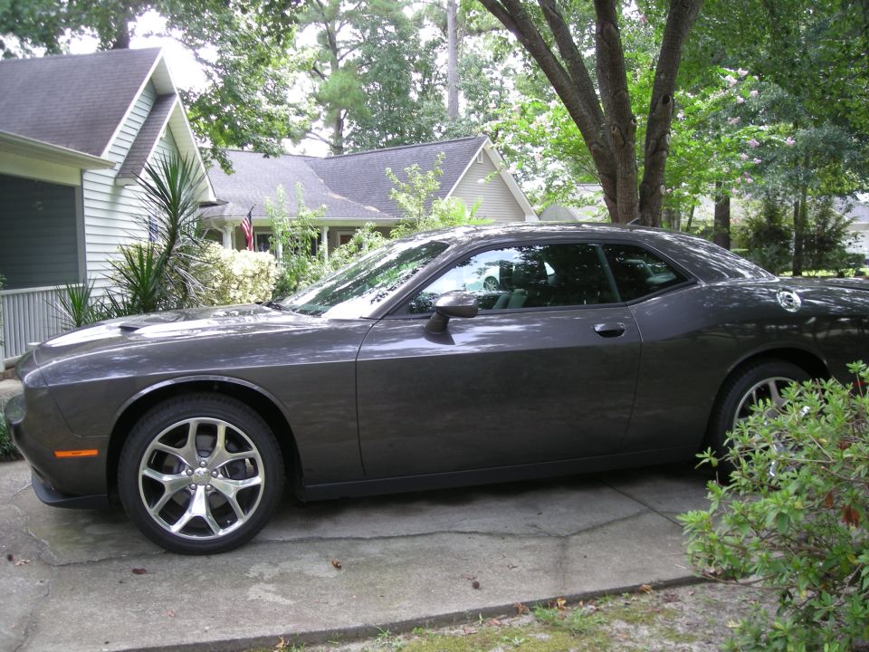 Dark gray Dodge Challenger parked in a driveway