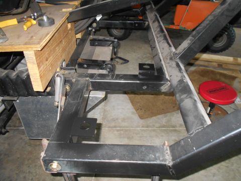 1992 Ford Bronco - A metal frame structure is shown with a wooden support and tools, suggesting a repair or fabrication process.