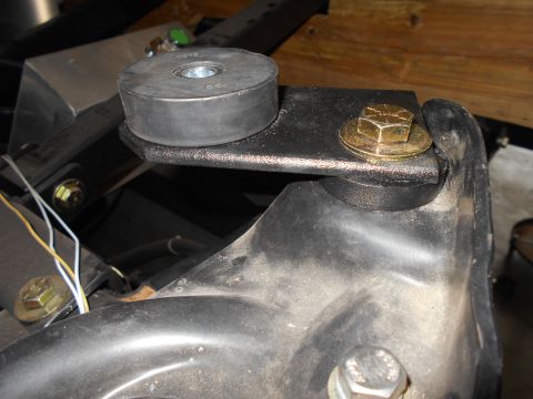 1992 Ford Bronco - Close-up of a rubber body mount and hardware, likely part of a vehicle's suspension or chassis.