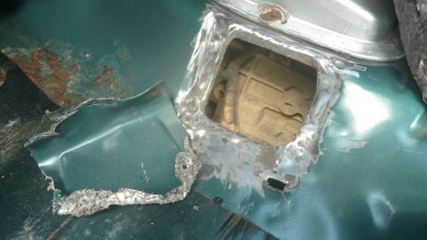 1996 Ford Bronco - Factory glued on cover. Also held on with four Phillips screws. Notice the nice shiny square hole? Don't use an air chisel, if you do then…