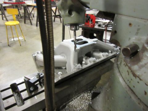 Intake manifold being machined on a milling machine
