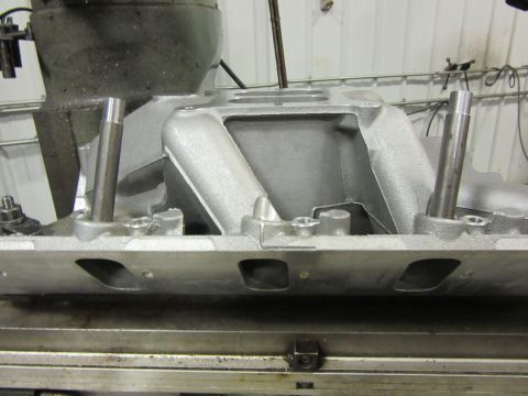 Aluminum intake manifold with two vertical pins and mounting holes