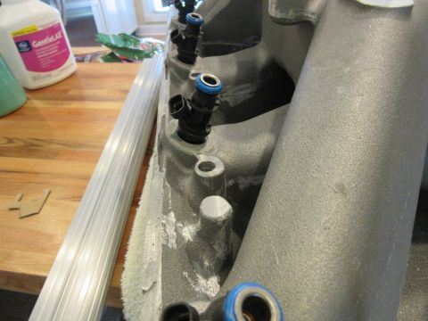 Engine intake manifold with fuel injectors visible
