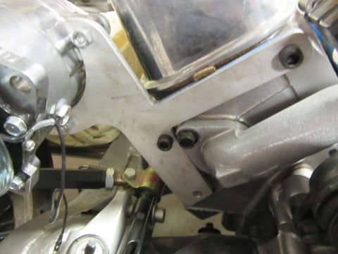 Engine bay detail with metal brackets and hoses