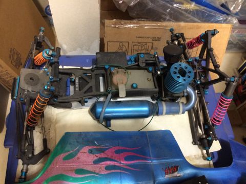 1989 Ford Bronco - This is a remote-controlled car chassis a blue engine and exhaust system, with a blue body shell adorned with flame graphics.