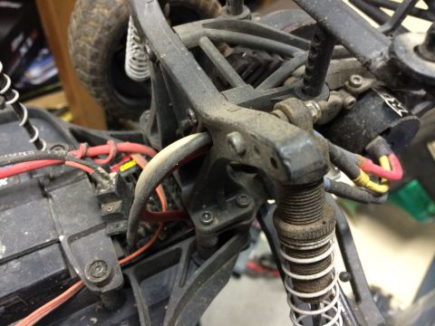 1989 Ford Bronco - The intricate suspension and wiring of a remote control car are shown in this detailed close-up.