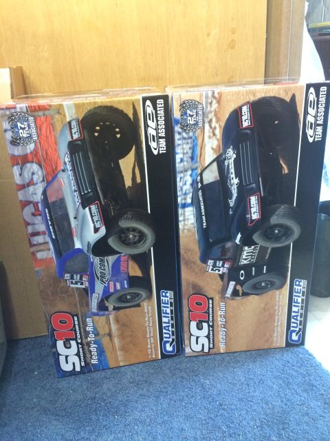 1989 Ford Bronco - Two boxes of RC short course trucks are displayed, each a graphic of the vehicle on-box vehicle.