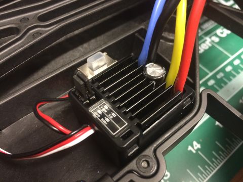 1989 Ford Bronco - The electronic speed controller for an RC vehicle is shown with its connected wires and heatsink.