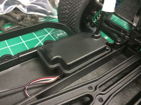1989 Ford Bronco - Close-up of a remote control car chassis, showing internal components and wiring.