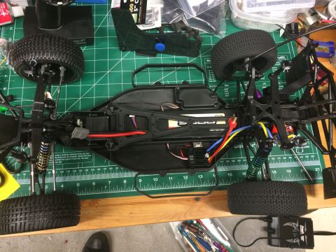1989 Ford Bronco - Chassis of a remote control car, showing internal components and suspension system.
