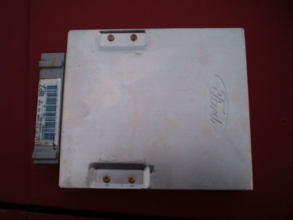 Ford engine control unit with a label showing '8PZ' and a barcode