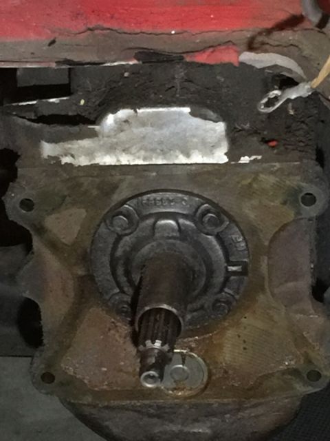 1978 Ford Bronco - A close-up view of a vehicle's transmission component, showing a splined shaft and housing.