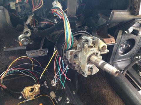 1968 Mercury Cougar - The interior of a vehicle shows a disassembled steering column with numerous wires exposed, indicating repair or modification.