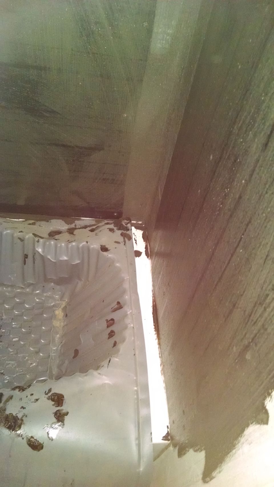 The tile man sealed the backer board, and made a mess on the downstairs tub.