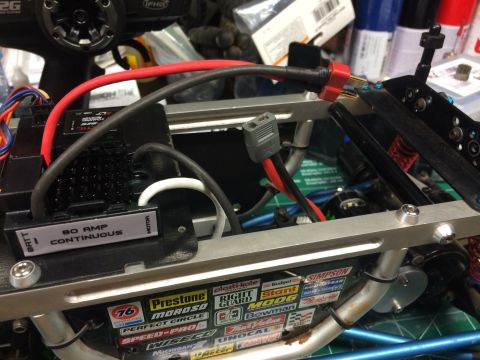 1989 Ford Bronco - Close-up view of the electronic speed controller and wiring for an RC car. The ESC is labeled "80 AMP CONTINUOUS" and has a black heatsink.