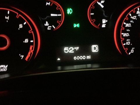 2015 Dodge Dart - The dashboard displays the temperature, mileage, and gear selection, confirming the vehicle's model year.