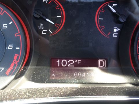 2015 Dodge Dart - Dashboard gauges display 102°F, 6641 miles, and the gear selector in Drive (D).