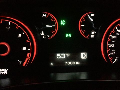 2015 Dodge Dart - The illuminated dashboard displays critical driving information including temperature, mileage, and gear selection.