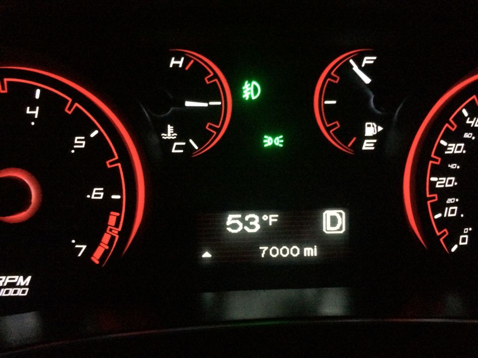 Dashboard with tachometer, speedometer, fuel gauge, temperature gauge, and digital display showing 53°F and 7000 miles