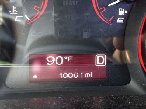 2015 Dodge Dart - A close-up of a car's digital dashboard displays the outside temperature as 90°F and the odometer reading as 10001 miles. The gear indicato…