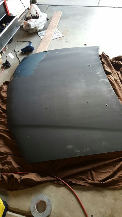 1996 Ford Bronco - A car hood is shown, possibly undergoing repair or refinishing.