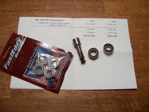 1999 Mercury Grand Marquis - A package of four FastEddy Ballbearings and a receipt are shown on a wooden surface. The receipt details the purchase of four 63800-2RS bea…