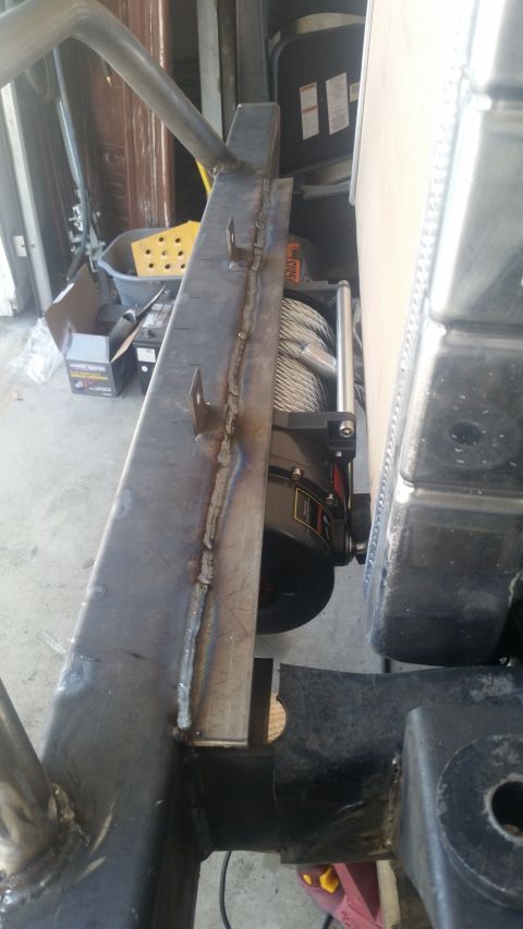 1979 Ford Bronco - A winch is mounted to a custom-fabricated bumper assembly, showing metalwork in progress.