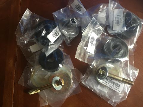 1978 Ford Bronco - Several new rubber mounts and bolts are packaged for sale, with part numbers and 'Made in Taiwan' visible on some labels.
