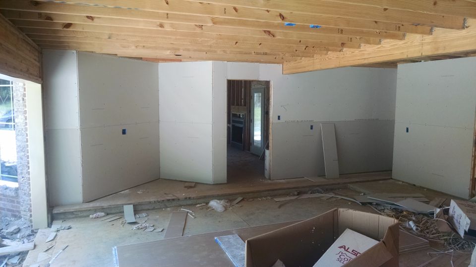 The garage walls were sheeted in preparation for foam insulation, but framing has not passed inspection yet.