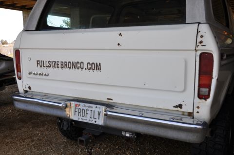 1979 Ford Bronco - Rear view of a white 1979 Ford Bronco, a "FULLSIZEBRONCO.COM" decal and a custom Maryland license plate.