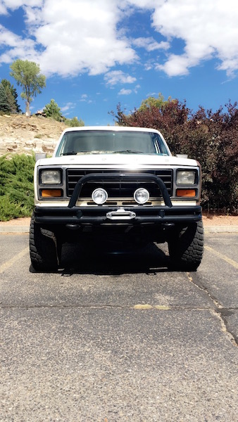 1981 Ford Bronco - Front view of a white 1980 Ford Bronco with a black bull bar and winch.