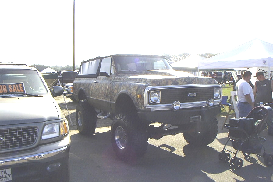 Lifted 1972 Chevrolet K5 Blazer with camouflage wrap and aftermarket wheels