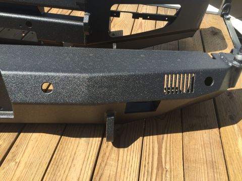 1988 Ford Bronco - Aftermarket steel bumper shown on wooden planks, likely for an off-road vehicle.