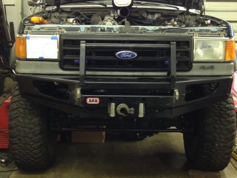 1988 Ford Bronco - This modified Ford Bronco features an aftermarket bumper and grille, suggesting a model year around 1987.