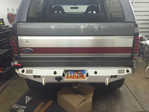 1988 Ford Bronco - The rear of a Ford Bronco is shown with a custom bumper and a license plate.