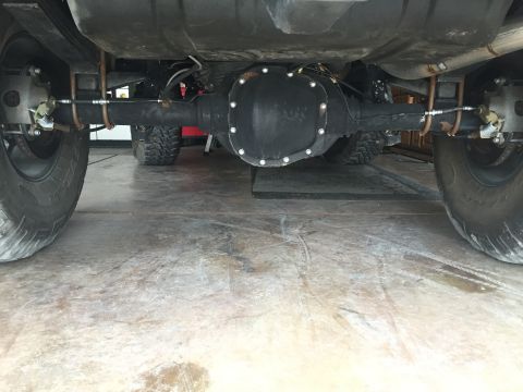 1988 Ford Bronco - Underside view of the rear axle and suspension components on a 1988 Ford Bronco.