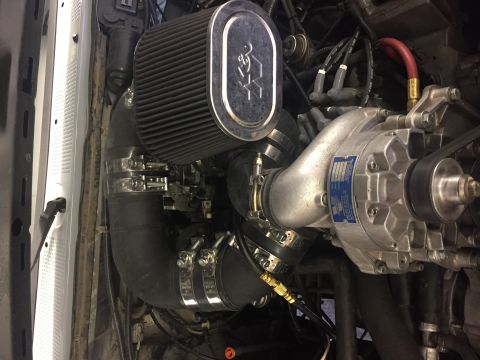 1988 Ford Bronco - Engine bay detail showing a supercharger, K&N air filter, and custom intake plumbing.