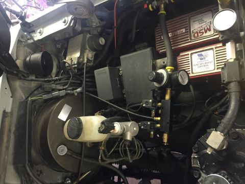 1988 Ford Bronco - Close-up view of engine bay components including MSD ignition and boost control systems.