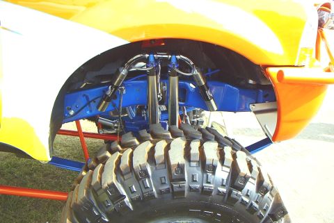 1995 Ford Bronco - Custom suspension and massive tires on a lifted vehicle.