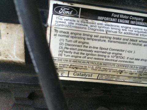 1988 Ford Bronco - Close-up of a Ford engine information sticker detailing timing procedures and oil specifications.