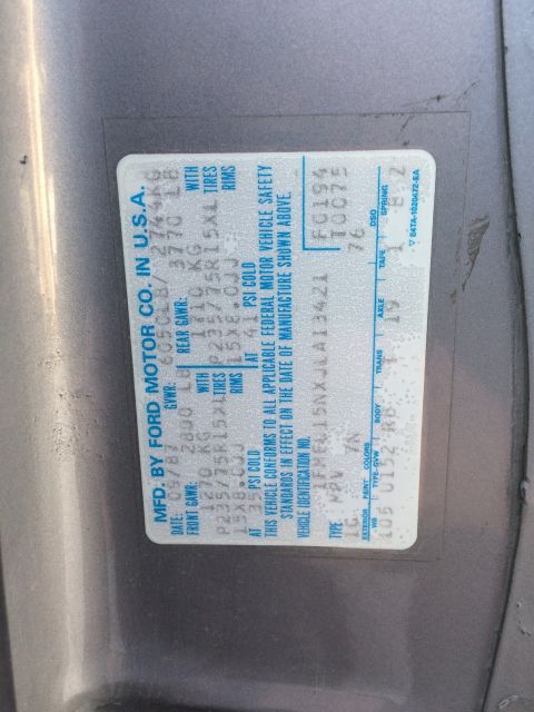 1988 Ford Bronco - A close-up of a vehicle's identification sticker, detailing manufacturing information and specifications.