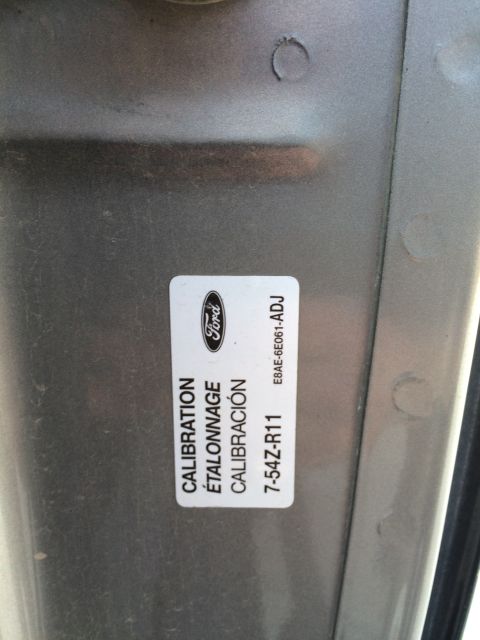 1988 Ford Bronco - A Ford calibration sticker is visible on a gray surface.