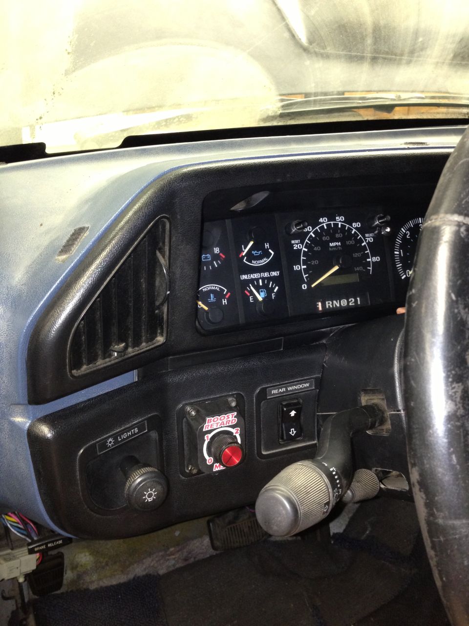 1988 Ford Bronco interior showing dashboard gauges, steering wheel, and light controls