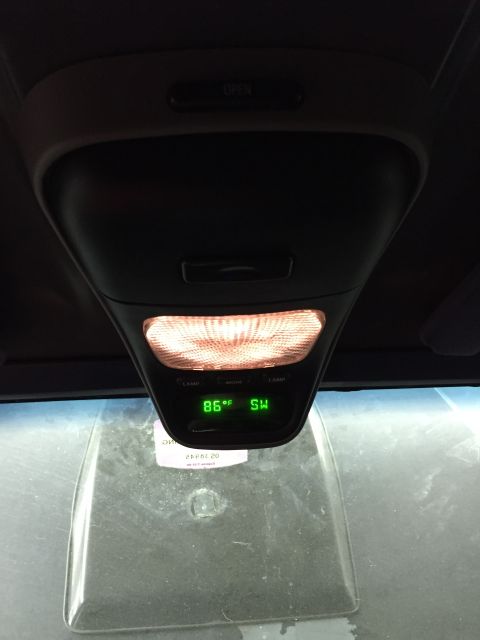 1988 Ford Bronco - Interior overhead console displays temperature and compass direction.